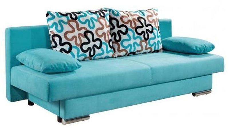 blaues Sofa, bunte Kissen mit Blumenmuster
